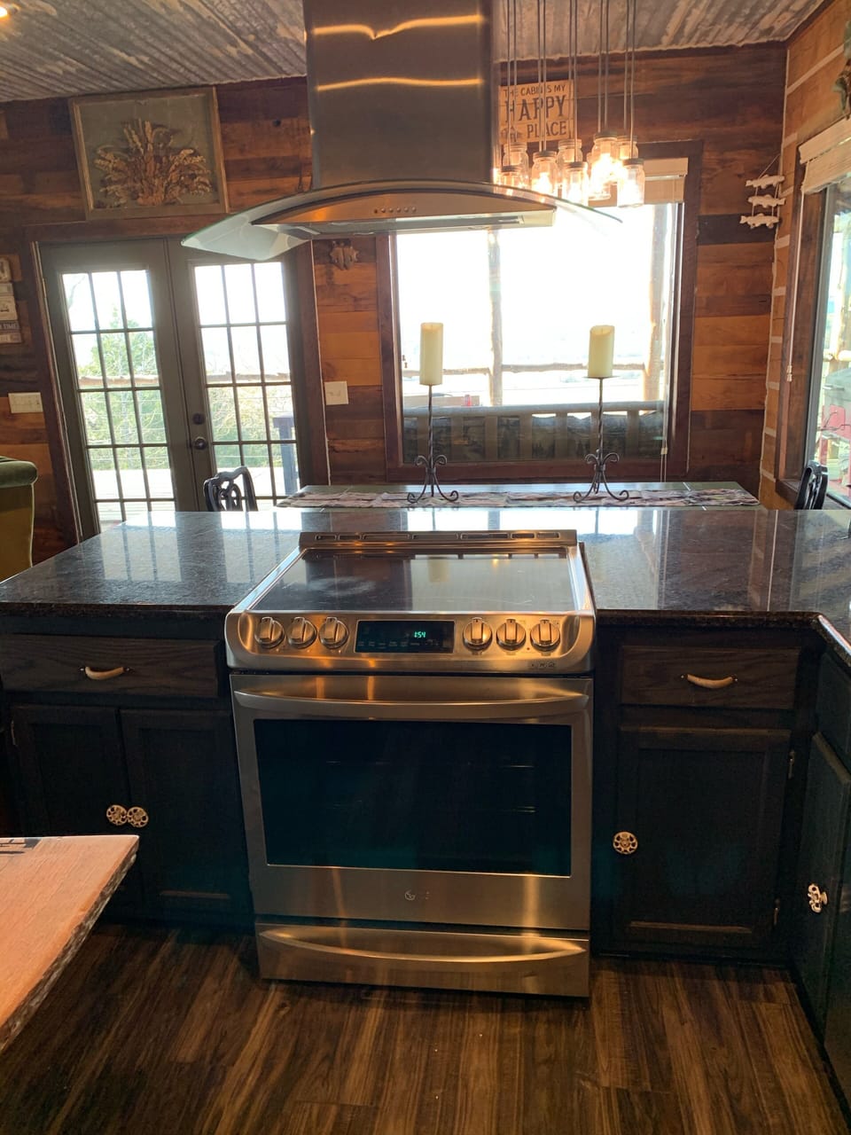 View of stove looking into dining area