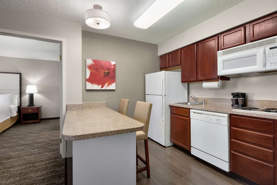 Suite, 2 Bedrooms | Private kitchen | Fridge, microwave, stovetop, dishwasher