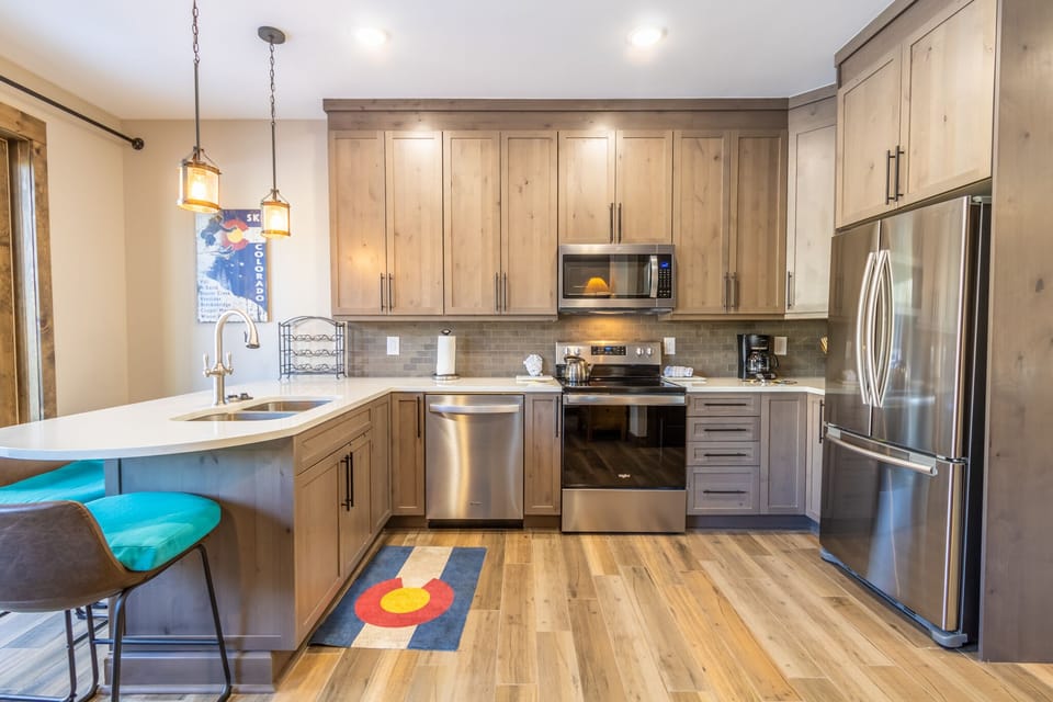 Your gourmet kitchen awaits with modern appliances and warm wood tones, perfect for creating memorable meals together.