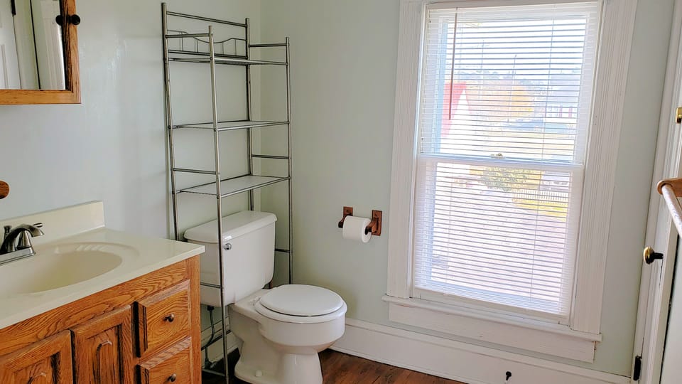 2nd level. Stand up shower. Located in hall