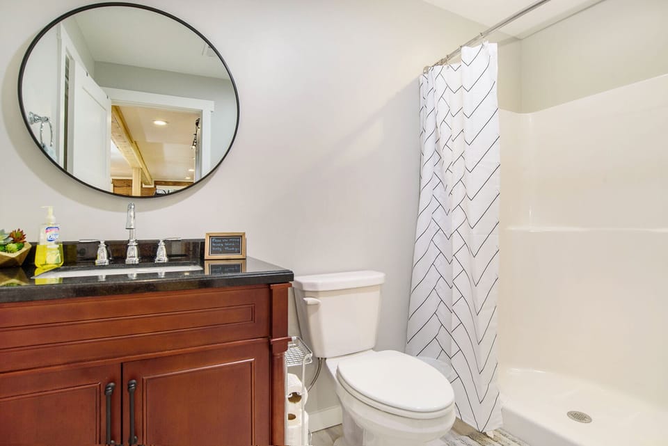 Main floor bathroom with extra shower for less sharing of space.