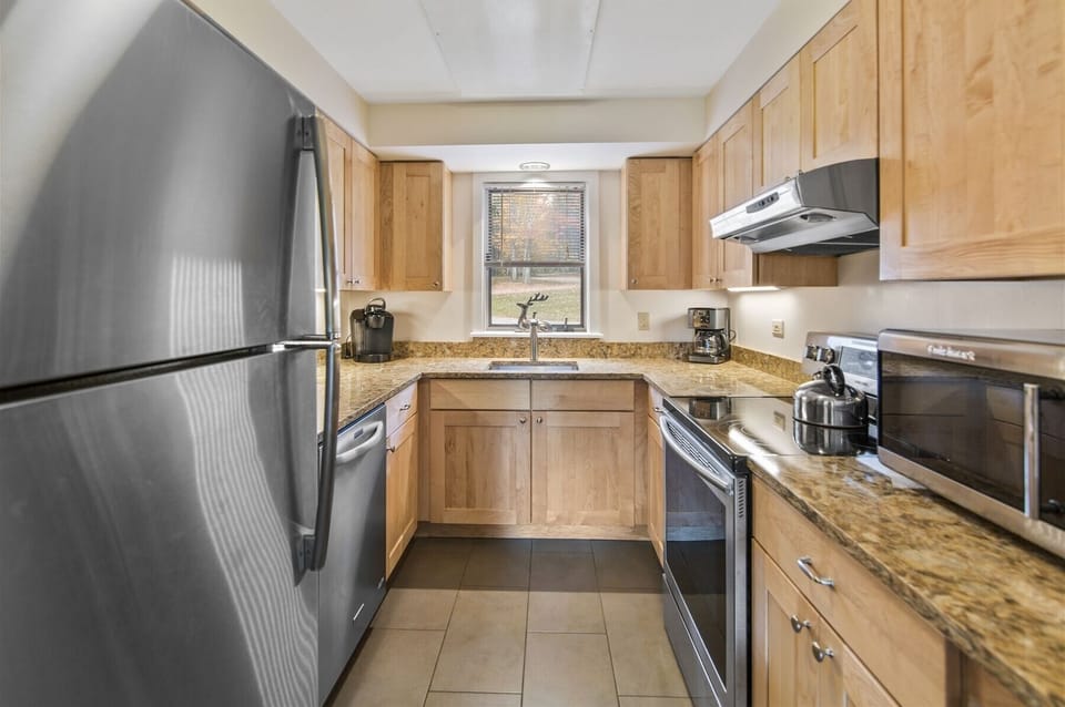 The well-equipped galley kitchen provides all the comforts of cooking in your own home