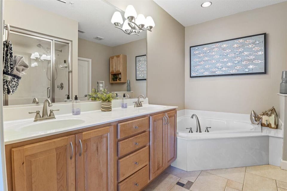 Master bath with jetted soaking tub and steam shower.