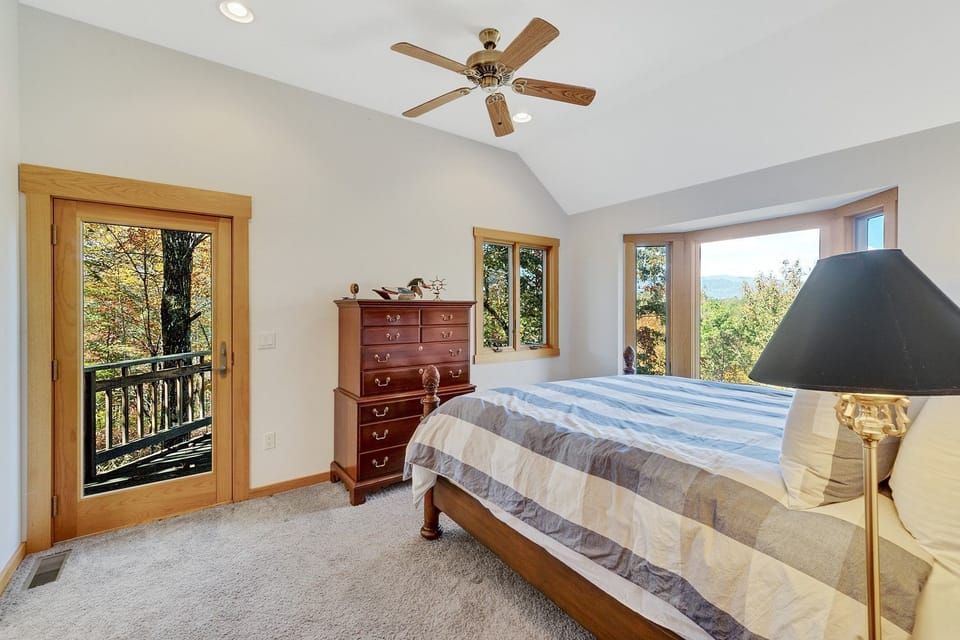 Main floor master with king bed and porch