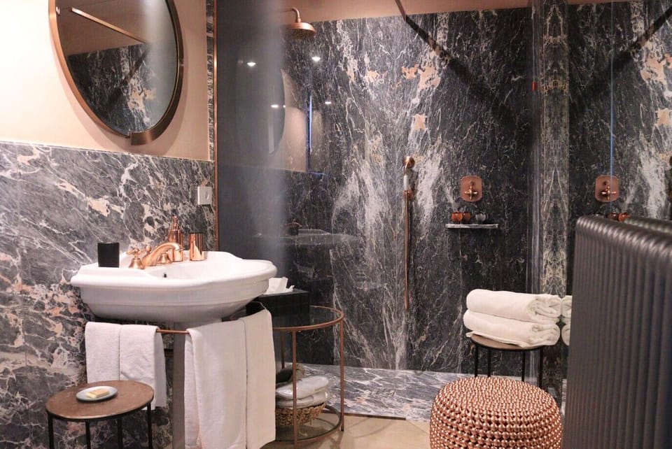Suite | Bathroom | Hair dryer, bathrobes, slippers, bidet