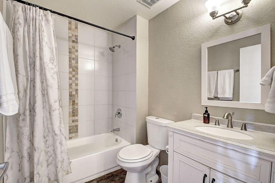 Main Bathroom has a tub-shower