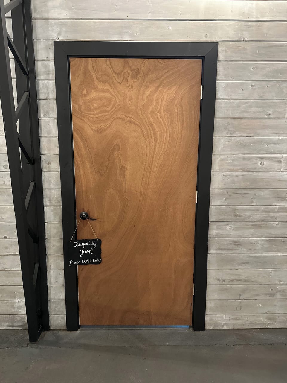 Door in main barn area to private suite