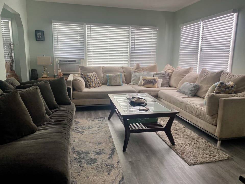 Large living room with oversize couch and chaise sofa