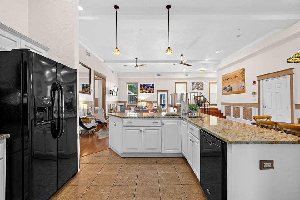 Spacious kitchen fully stocked with pots, pans, and cooking utensils for in home meals