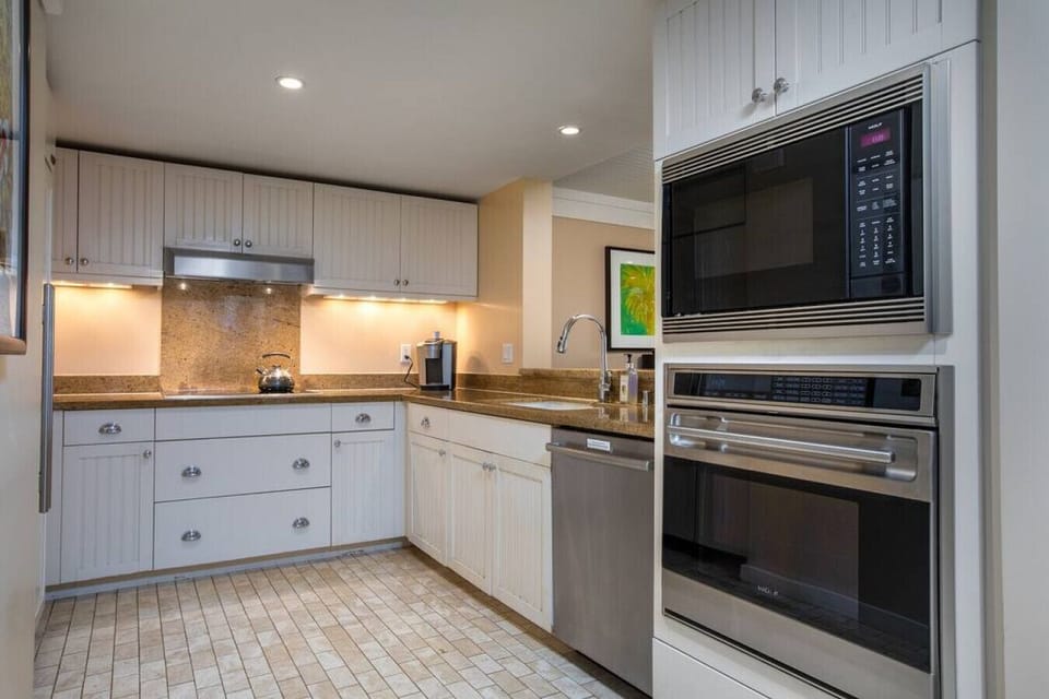Sleek kitchen w/ modern finishes ready for simple vacation meals