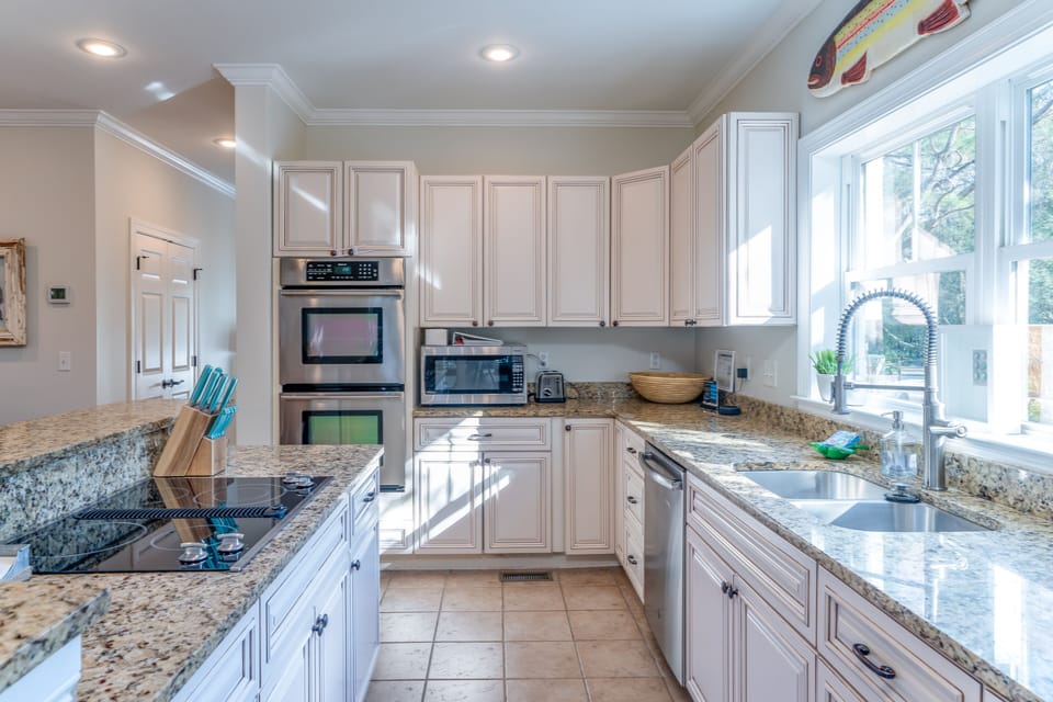 Stainless steel appliances and granite countertops.
