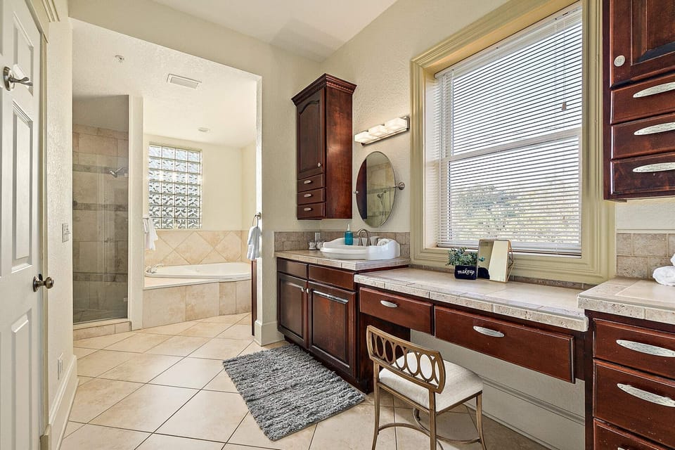 Luxurious master bath with makeup setting to get ready at