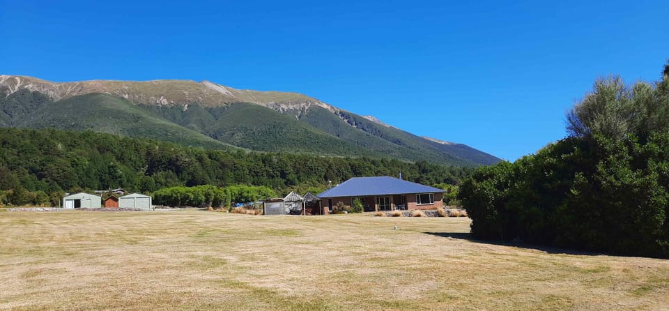 View of homestay with cabin in the background - as seen from the highway.