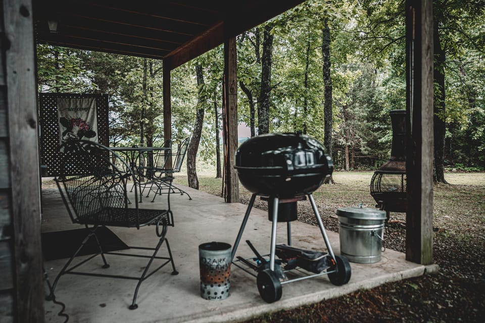 Covered back porch w/table, chairs, BQ grill, chiminea & that amazing view!