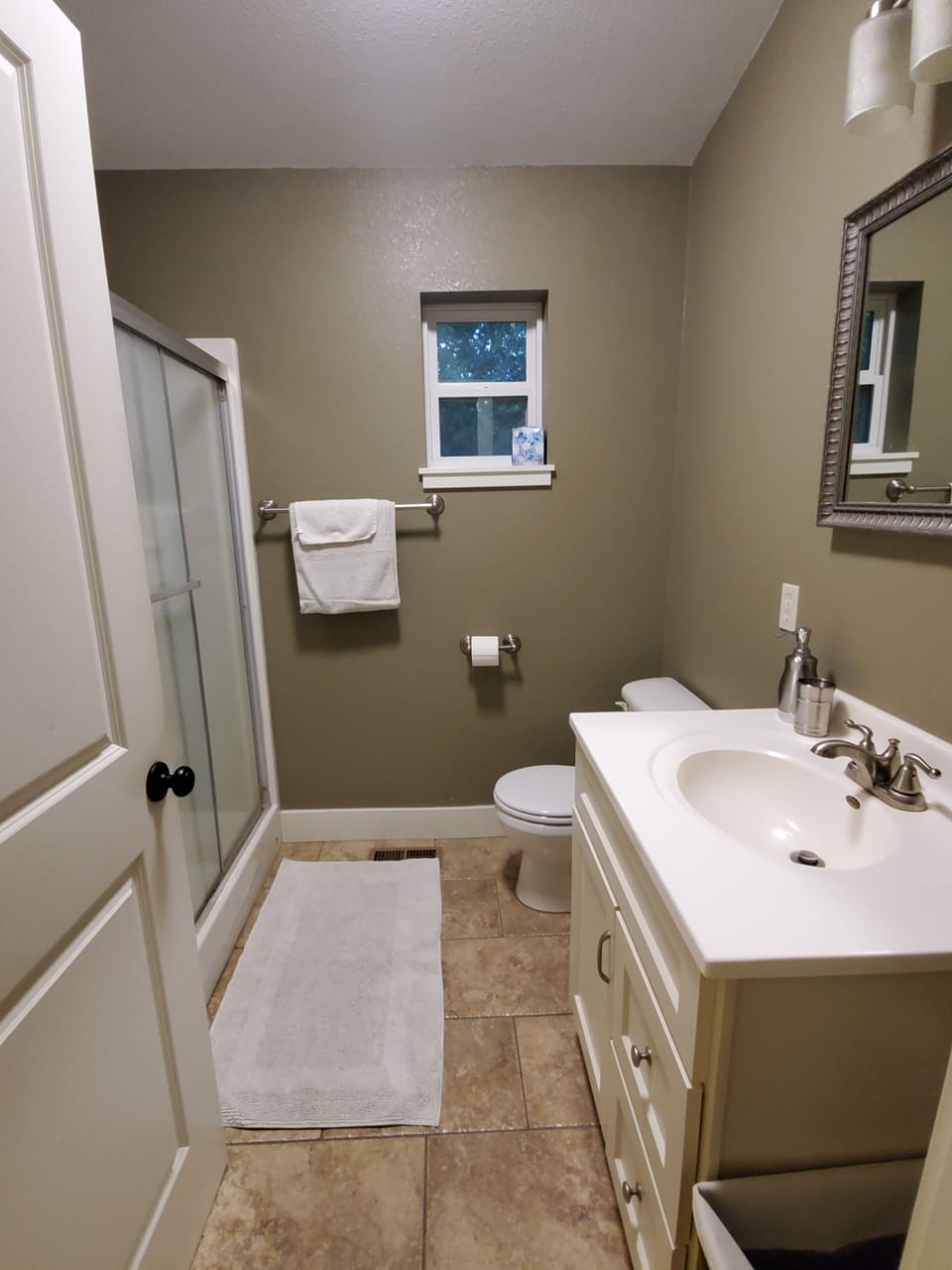 Primary Bathroom with shower and large capacity washer and dryer.