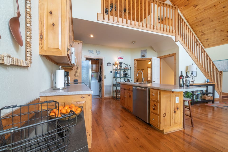 Fully equipped kitchen with quiet dishwasher, large fridge, micro, coffee bar