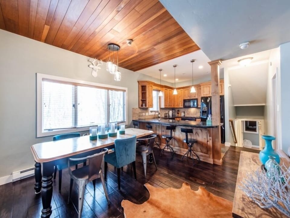 Kitchen with bar seating area.  Master bedroom, bathroom 3 and and entrance way down a few stairs.