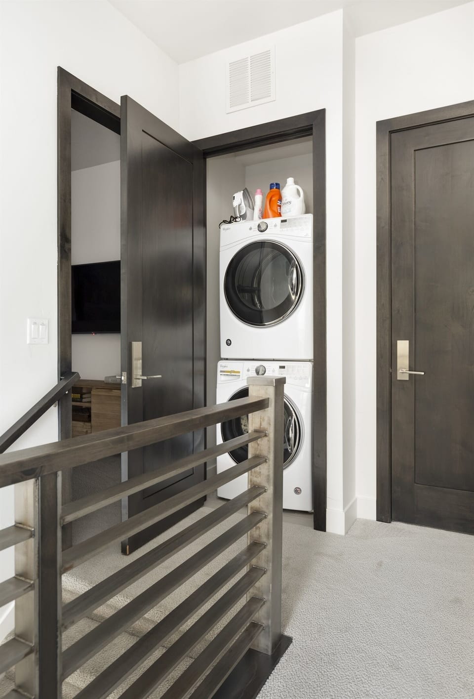 Top of stairs, 'den' and bedroom 3 on right, laundry closet straight ahead.t