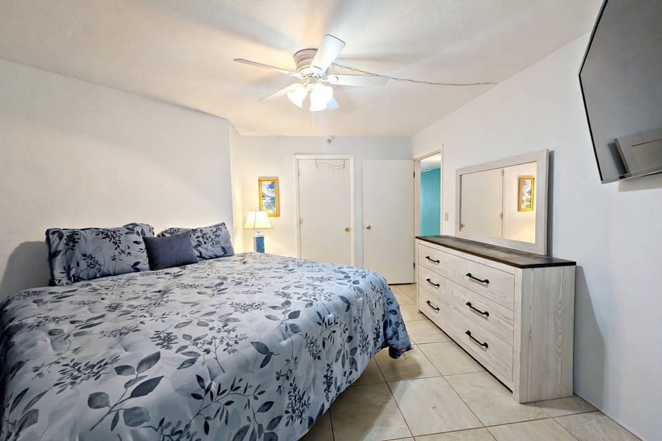 ...ceiling fan and closet. Also, there is a 32" cable TV mounted on the wall for late-night viewing.