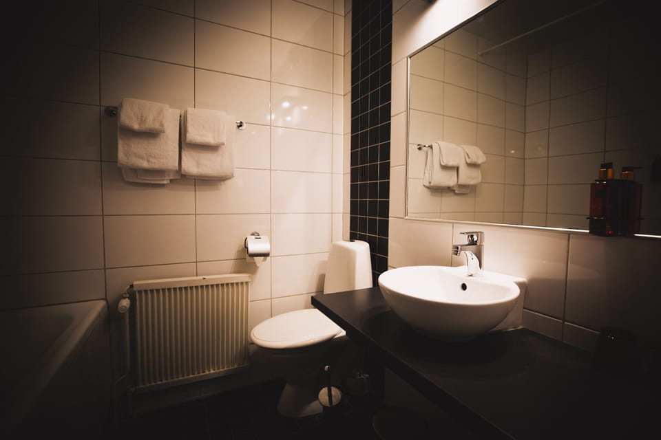 Junior Studio Suite | Bathroom | Hair dryer, towels