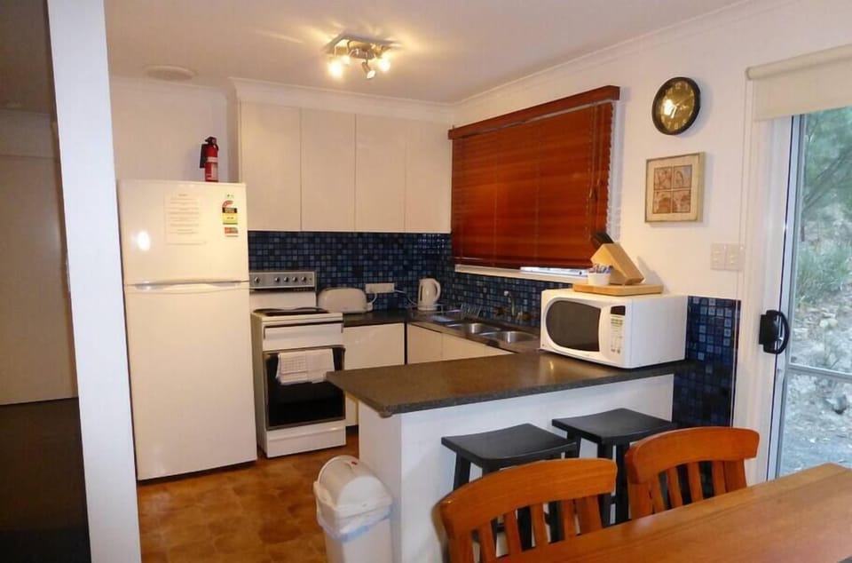 Delight in our fully-equipped kitchen for a hassle-free stay.