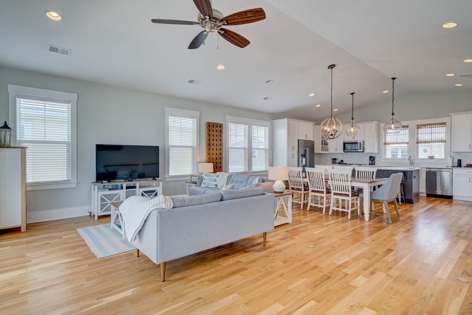 Open living/dining room with cathedral ceiling