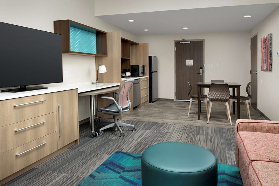 Suite, 1 King Bed, Accessible (Mobility & Hearing, Roll-in Shower) | Desk, laptop workspace, blackout drapes, iron/ironing board