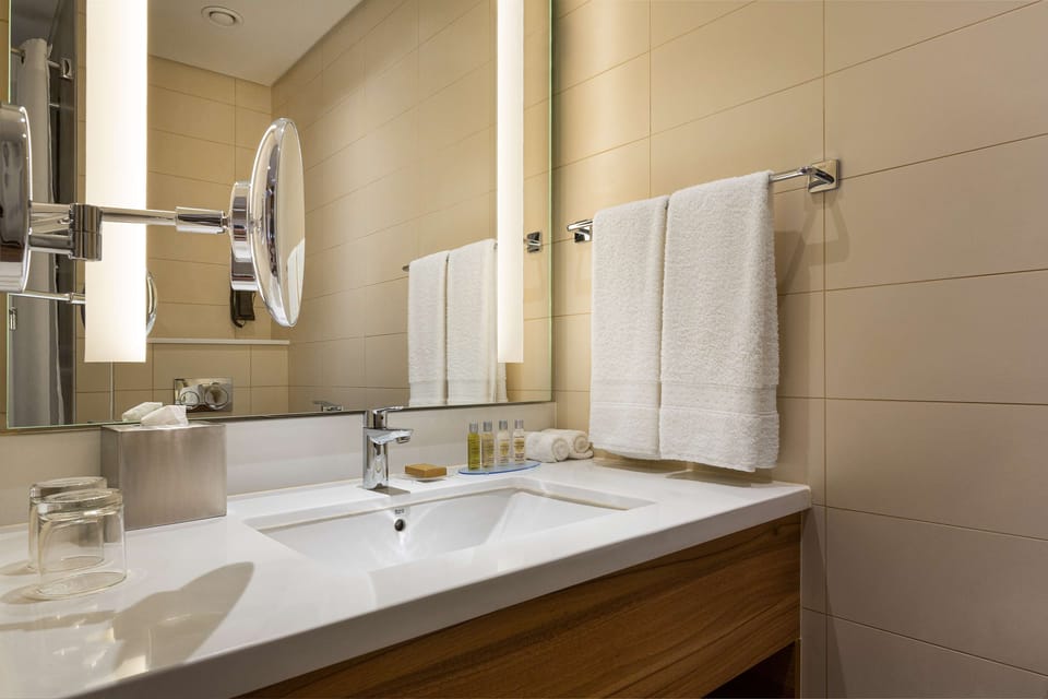 Deep soaking tub, rainfall showerhead, hair dryer, slippers