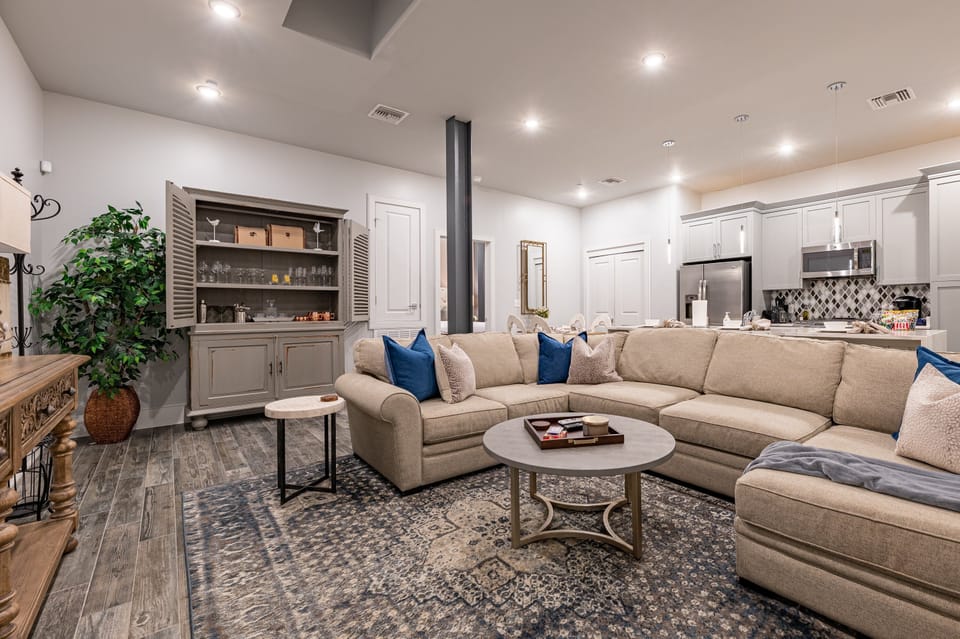 Open-concept living, kitchen, and dining area with ample seating for you and your guests. Enjoy a Samsung Smart 4K TV for streaming and DIRECTV Entertainment. The extra-large sectional also converts into a queen-size sleeper sofa!