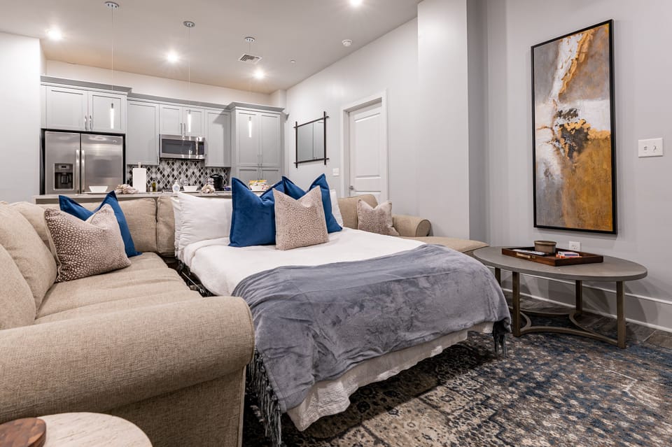 Open-concept living, kitchen, and dining area with ample seating for you and your guests. Enjoy a Samsung Smart 4K TV for streaming and DIRECTV Entertainment. The extra-large sectional also converts into a queen-size sleeper sofa!