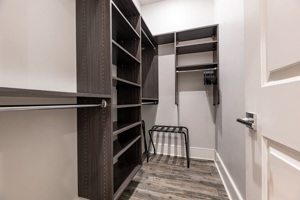 Spacious walk-in closet in guest bedroom.
