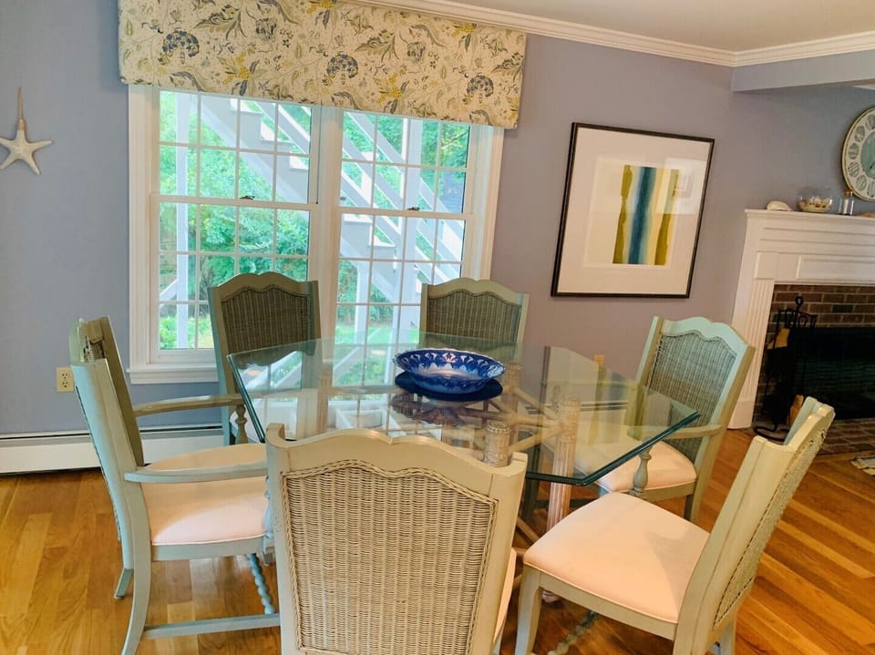 Large glass round table with comfortable chairs for dining