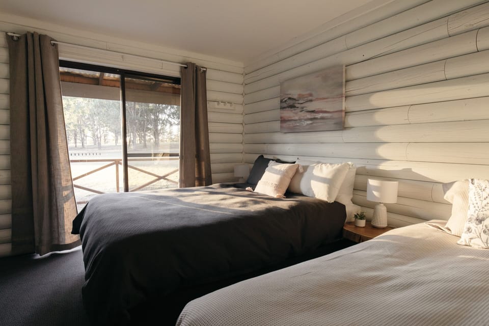 Two Bedrooms Self Contained Lodge | Minibar, in-room safe, blackout drapes, iron/ironing board