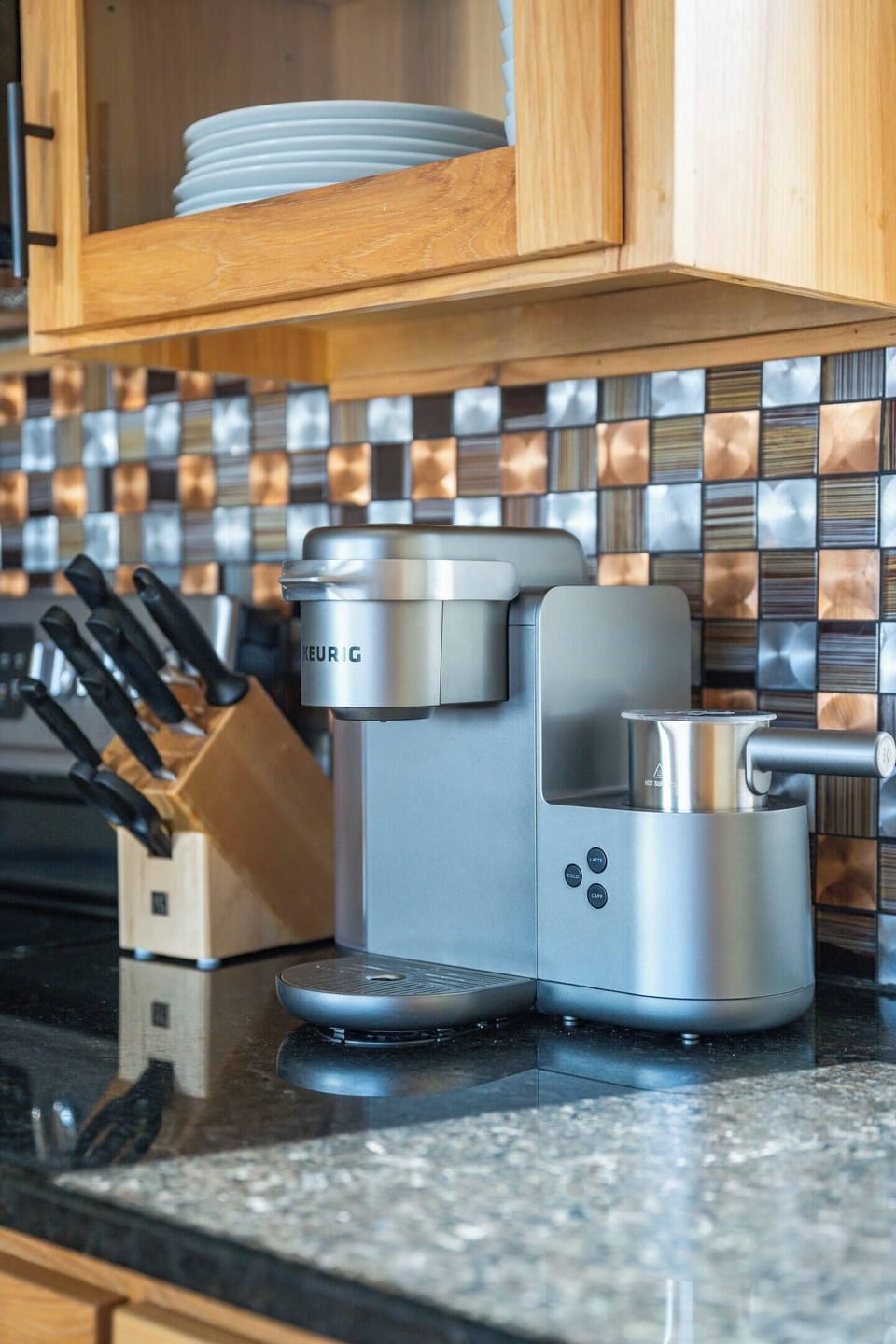 Brew your morning cup with the Keurig and take in cove views from the kitchen window.