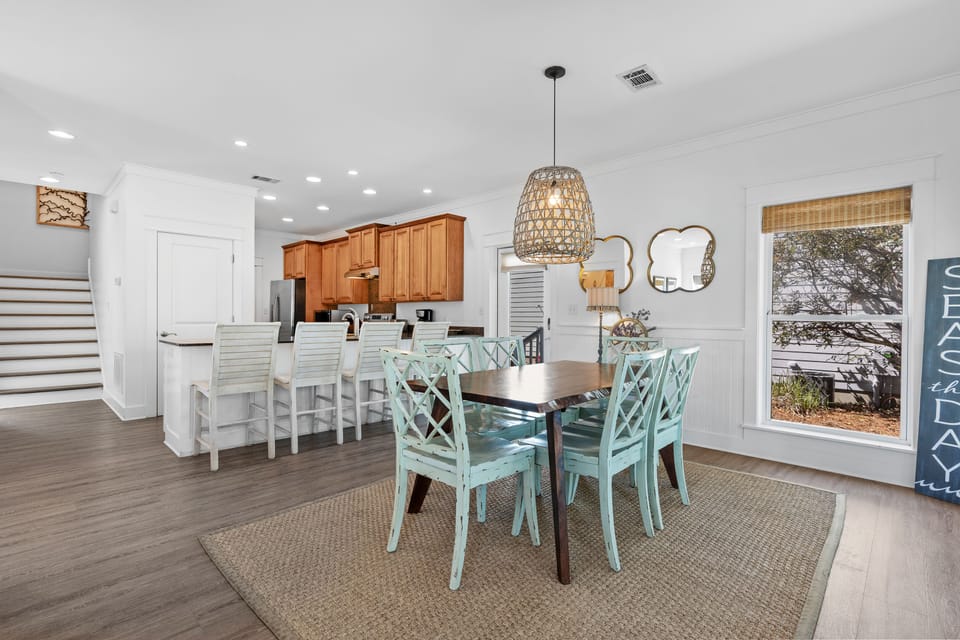 Coastal-inspired dining area with seating for six and a bright, airy feel—perfect for family meals and gathering after a day exploring 30A.