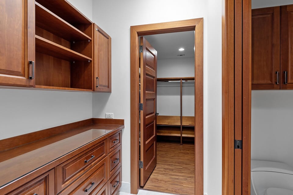 Ample built-in drawer space and large walk-in closet in upstairs primary bath
