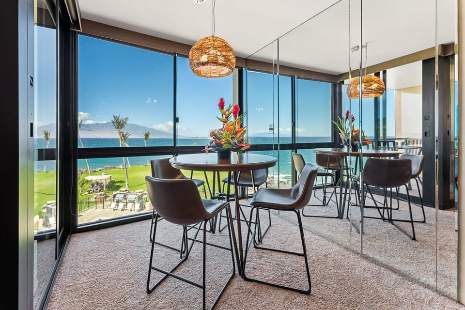 Dining table with 4 matching leather chairs.