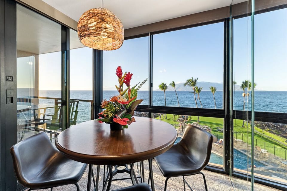 Dining table with 4 matching leather chairs.