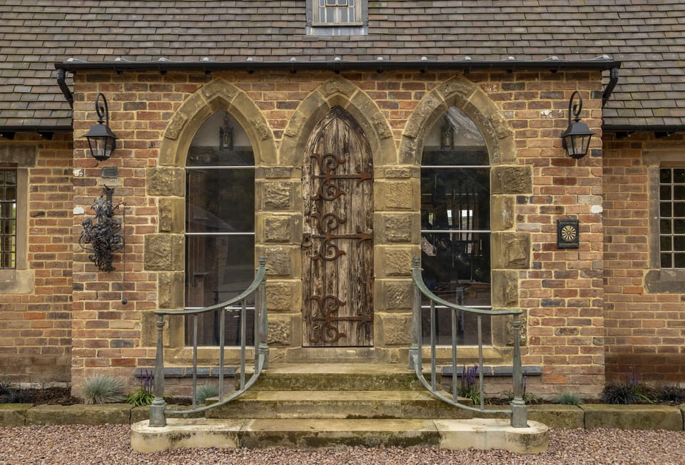 The enchanting front door is the first glimpse at this unique and stunning property