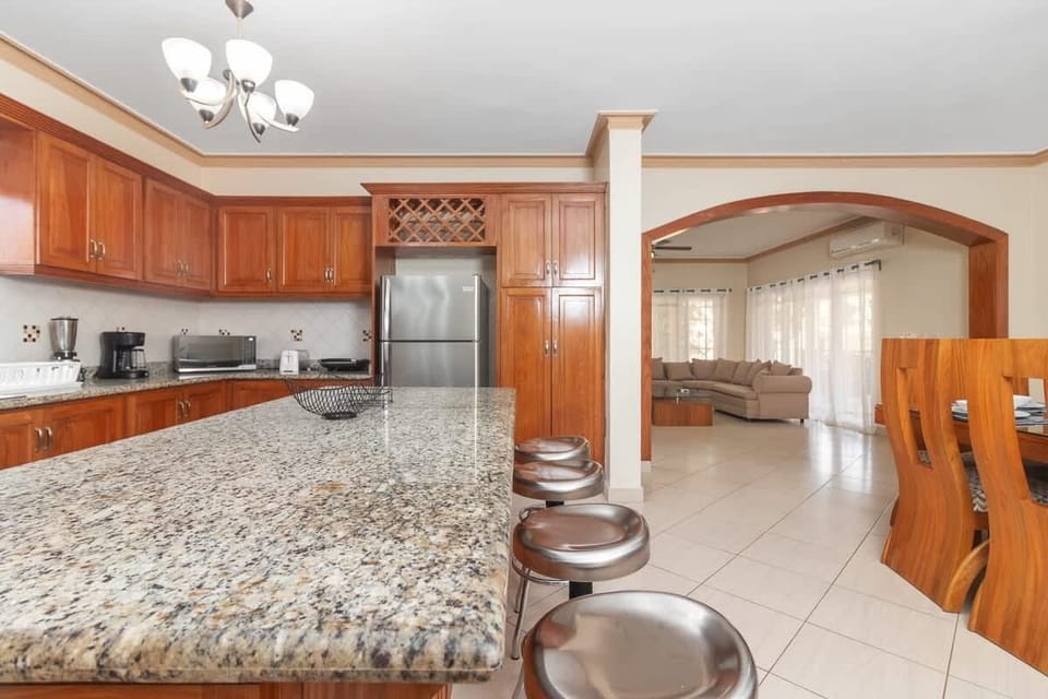 Gourmet Kitchen: Craft delicious meals in a stunning space with a grand island and modern appliances!