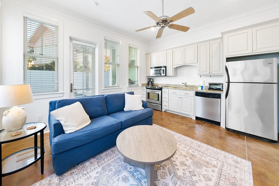 Relax on your cozy blue sectional while cooking in your fully-equipped kitchen with stainless steel appliances and granite countertops.