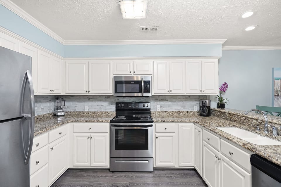 Your fully equipped kitchen features granite countertops, stainless appliances, and everything you need to create memorable meals during your stay.