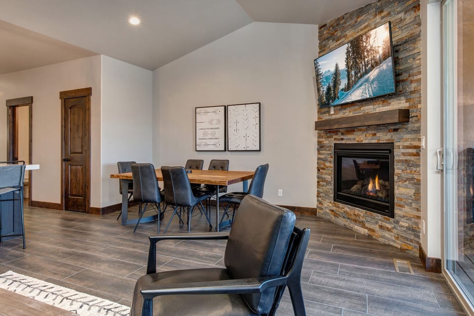 Living Room with gas fireplace, 50" Samsung Smart TV, pull out sofa bed, and private patio access