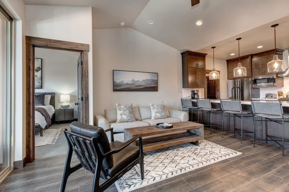 Living Room with gas fireplace, 50" Samsung Smart TV, pull out sofa bed, and private patio access