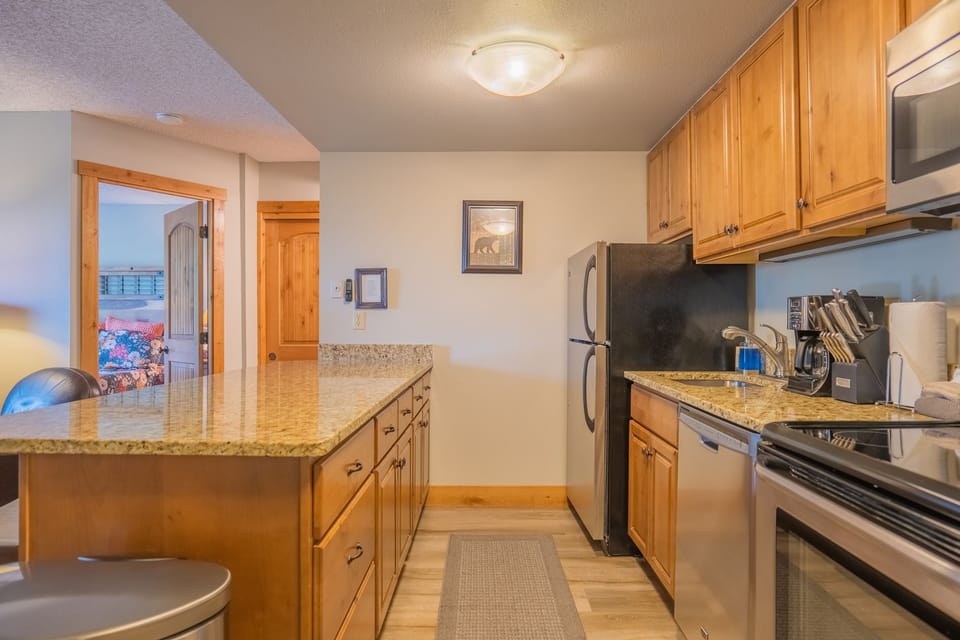 Fully stocked kitchen with dishes and cookware
