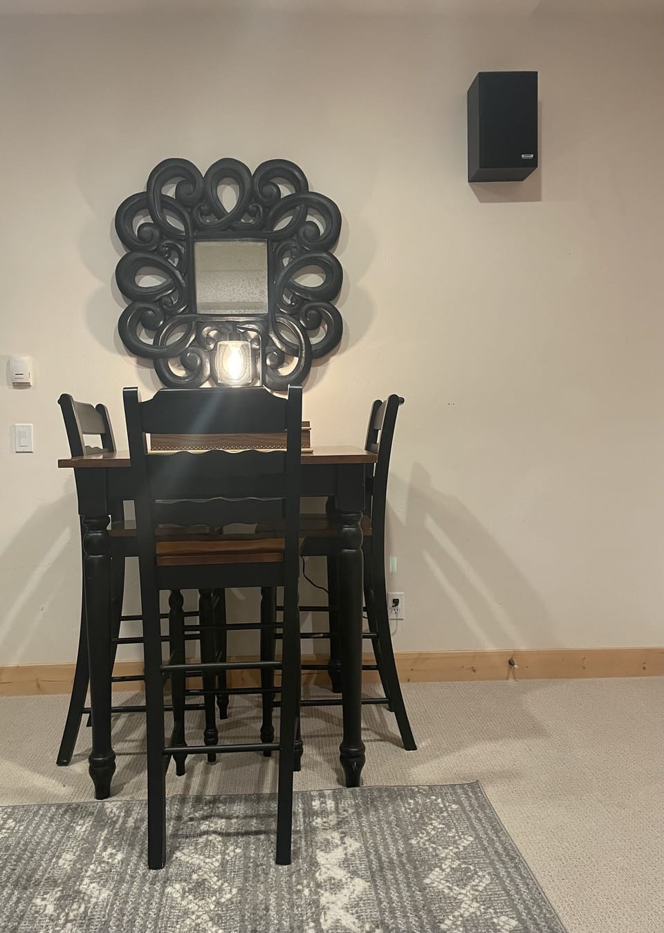 Bar table close to wet bar in downstairs living area.