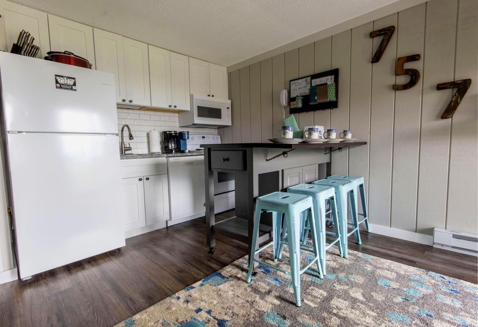 The unit features a modern kitchen with granite countertops and has all the basics you'll need to prepare, cook, and serve a delicious meal.