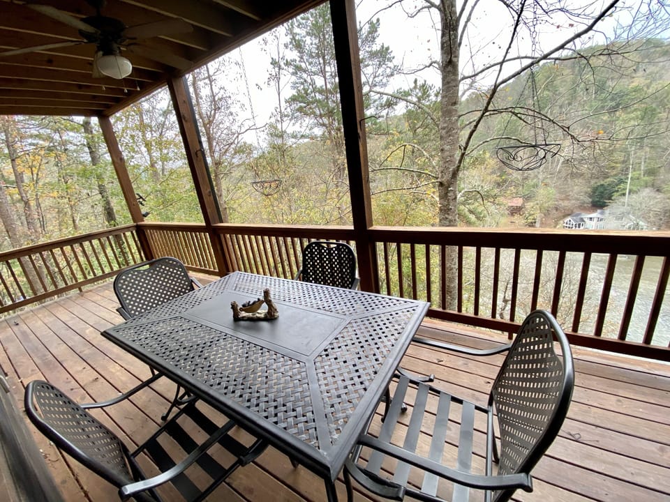 Main level patio seating with view of river