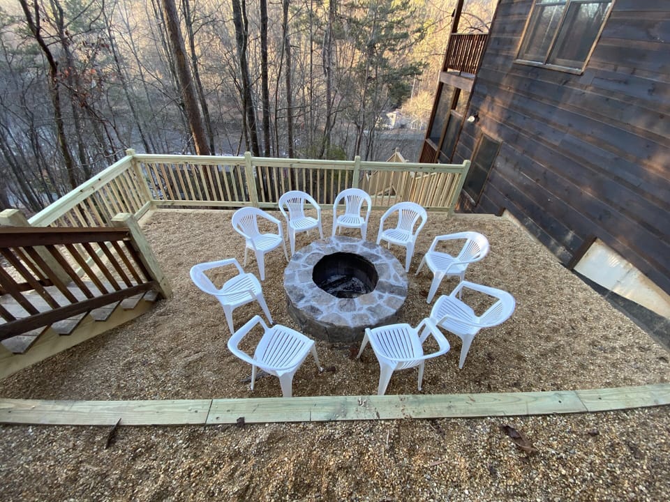 Fire pit area with river view, plenty of room for everyone to make s’mores!