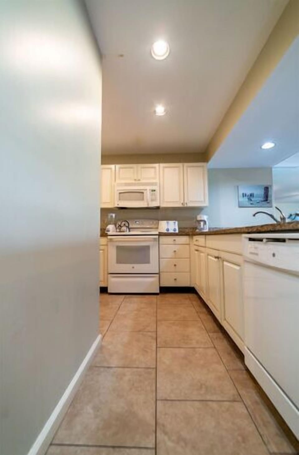 Your beautiful modern kitchen has a view and a full size washer & dryer, too.